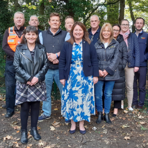 Commissioner Zoe with members of the public and local Councillors - pose for picture in layby