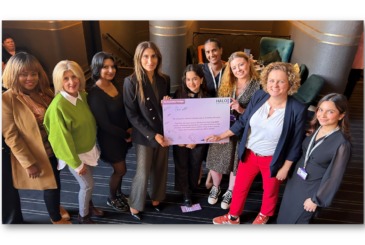 Yasmin Khan Director of The Halo Project and Jo Coles Deputy Mayor for Policing Fire and Crime with members of the Halo team holding the partnership pledge